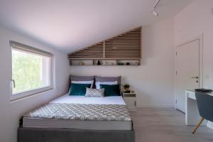 a bedroom with a bed and a window at Kosmajski Izvor in Sopot +81 photos