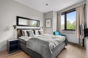 Postel nebo postele na pokoji v ubytování Hurdalsjøen Hotel & Spa + 37 fotografií