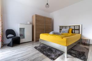 Giường trong phòng chung tại Ramino Apartments