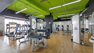 a gym with several treadmills and machines at Ala Moana Hotel _ Ocean view with balcony in Honolulu