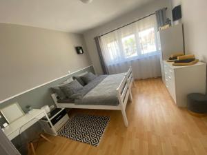 Postel nebo postele na pokoji v ubytování Apartment and rooms EL