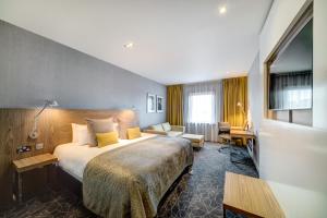 Postel nebo postele na pokoji v ubytování Apex City of Glasgow Hotel