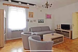 a living room with a couch and a table at Beachfront Dubrovnik Villa in Dubrovnik