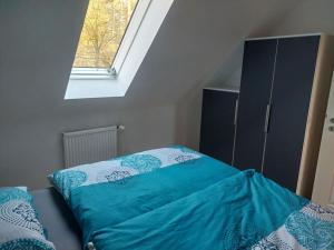 Кровать или кровати в номере Ferienwohnung Schmidt