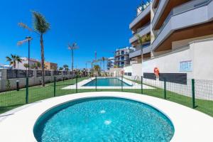 een zwembad voor een gebouw bij Casa Marinsa in Torrox Costa