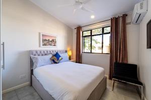 Posteľ alebo postele v izbe v ubytovaní 128 Platinum Peak Victoria Falls