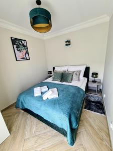 Tempat tidur dalam kamar di Green Dream Apartment Pobierowo KRYTY BASEN