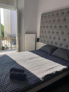 a bedroom with a large bed with a large headboard at Rooms Spanie 7-Rynek Centrum &f-vat in Kielce +57 photos