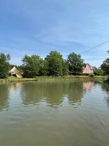 a view of a river with houses and trees at Glamping Tent Mariehamn in Mariehamn