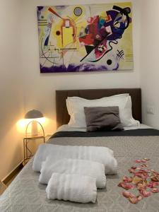 Posteľ alebo postele v izbe v ubytovaní SuitesGaribaldi