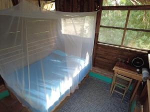 hostal pakal客房内的一张或多张床位