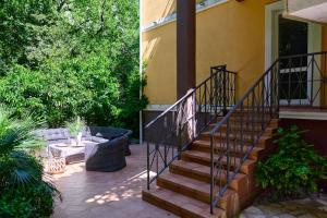 a set of stairs leading up to a house at GREEN HILL Aparts with POOL & SCENIC VIEW in Gornji Orahovac