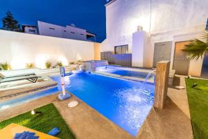 a swimming pool in the backyard of a house at Casa de las Sirenas, Las Conchas, Private Pool in Puerto Peñasco