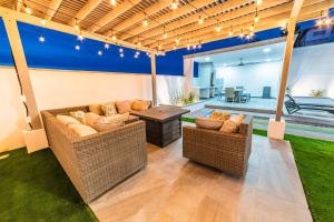 a living room with two couches and a table at Casa de las Sirenas, Las Conchas, Private Pool in Puerto Peñasco +115 photos