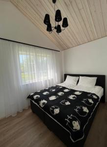 Кровать или кровати в номере Žalčio guolis