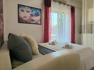 Posteľ alebo postele v izbe v ubytovaní Elite Residence Flos