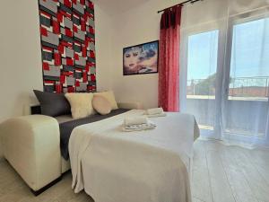 Posteľ alebo postele v izbe v ubytovaní Elite Residence Flos