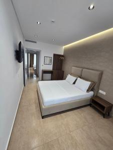Postel nebo postele na pokoji v ubytování Sunlight Hotel