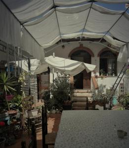a white tent in front of a house at B&B CasaCorì in Orosei