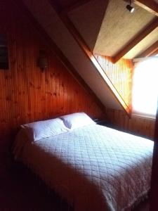 Postel nebo postele na pokoji v ubytování CABAÑA 325 centro de QUELLON