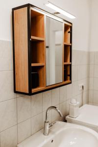 a bathroom with a sink and a mirror at 5 Bett-Wohnung in guter Lage von Geilenkirchen in Geilenkirchen