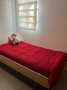 Een bed of bedden in een kamer bij Seguridad y Tranquilidad