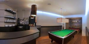 a bar with a pool table in a room at Le Grand Tétras in Font-Romeu