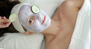 a woman wearing a mask with cucumbers on her face at Boracay Luxury Apartments in Boracay