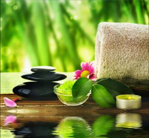 a group of spa items sitting on a wooden table at Boracay Luxury Apartments in Boracay