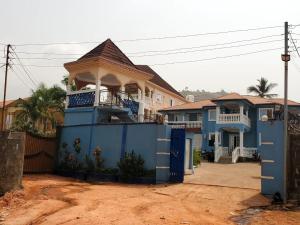 una casa azul con un cenador encima en Royal Island Breeze Resort SL en Freetown