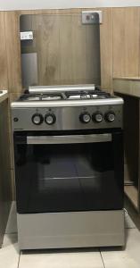 a stainless steel stove in a kitchen at lewis & lawrenda (ddt) in Haatso