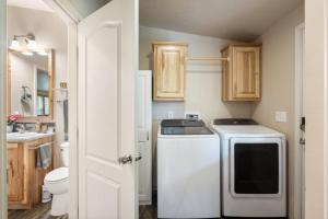 a small kitchen with a stove and a sink at Country living in a small town in Deer Park +29 photos