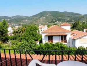 a view of a house from a balcony at Hotel Kavouris in Skopelos Town