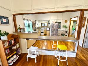 a kitchen with a large counter in a room at Jindy's Cottage Atherton in Atherton