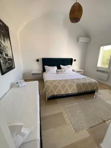 Postel nebo postele na pokoji v ubytování Thinissut Guest House + 37 fotografií