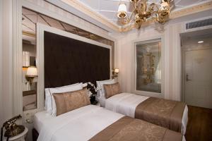Кровать или кровати в номере Istanbul Town Hotel