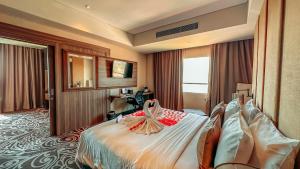 Ein Bett oder Betten in einem Zimmer der Unterkunft Swiss-Belinn Karawang