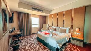 Ein Bett oder Betten in einem Zimmer der Unterkunft Swiss-Belinn Karawang
