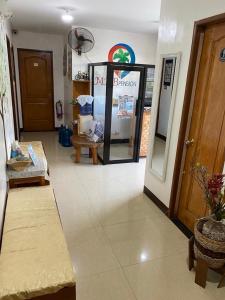 a room with a store with a mirror and a room with at MKB Pension in Coron
