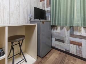 TV a/nebo společenská místnost v ubytování Business Hotel Kaga