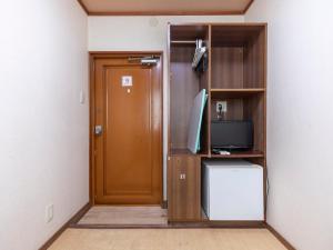 TV a/nebo společenská místnost v ubytování Business Hotel Kaga