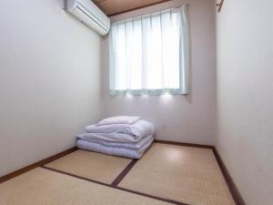 Postel nebo postele na pokoji v ubytování Business Hotel Kaga