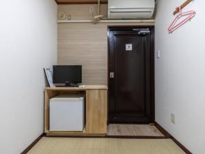 TV a/nebo společenská místnost v ubytování Business Hotel Kaga
