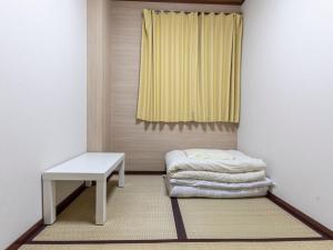 Postel nebo postele na pokoji v ubytování Business Hotel Kaga