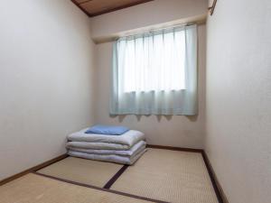 Postel nebo postele na pokoji v ubytování Business Hotel Kaga