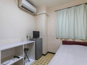 Postel nebo postele na pokoji v ubytování Business Hotel Kaga