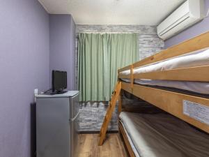 Postel nebo postele na pokoji v ubytování Business Hotel Kaga