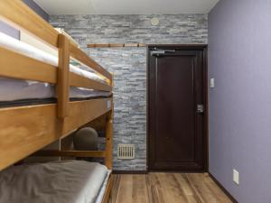 Postel nebo postele na pokoji v ubytování Business Hotel Kaga