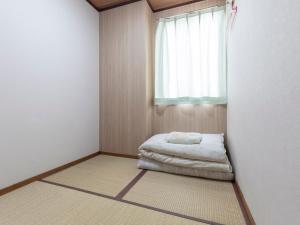 Postel nebo postele na pokoji v ubytování Business Hotel Kaga