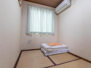 Postel nebo postele na pokoji v ubytování Business Hotel Kaga